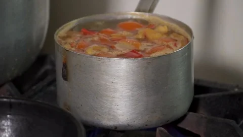Closeup of the soup boiling on the stove Stock Footage 73476532