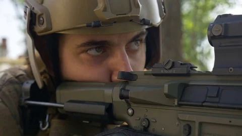 Closeup of special forces soldier watching his target preparing to fire Stock Footage 78032816