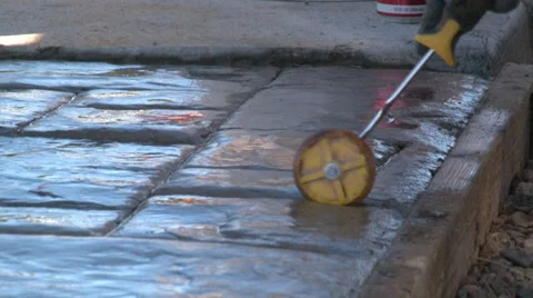 Closeup of specialized hand tools producing decorative pattern in cement slab Stock-Footage 39906089