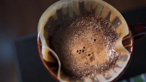 Closeup specialty coffe drip in pot. Rotating zoom-in slow motion Stock Footage 123574319