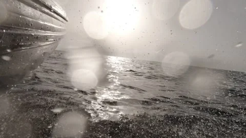 A closeup of a speedboat ploughing through the waves at sunrise Stock-Footage 243038153