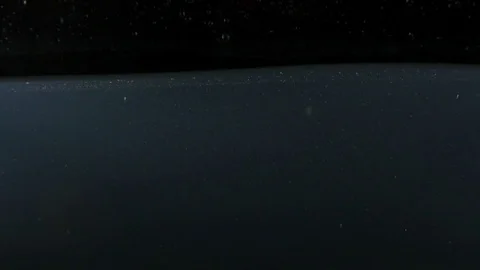 Closeup of spinning red apple falling into water on the black backgrond slow Stock Footage 75790594