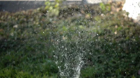 Closeup splashing water in slow motion in a daylight. Stock Footage 142881084