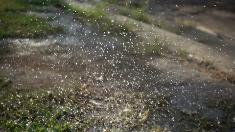Closeup splashing water in slow motion in a daylight. Stock Footage 142881953