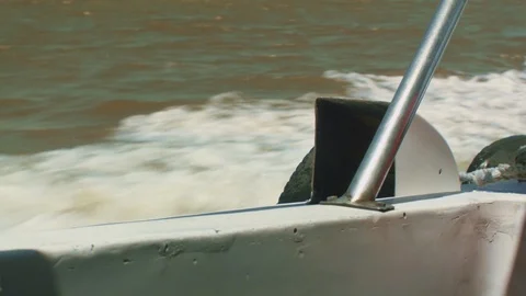 Closeup of Splasing Water Beside an Accelerated Speed Boat Stock Footage 106636314