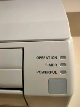 Closeup of split air conditioner on a white wall. Stock Photos
