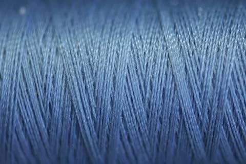 Closeup of a spool of blue thread Stock Photos
