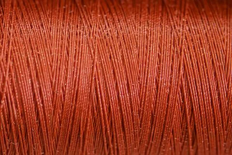 Closeup of a spool of red thread Stock Photos