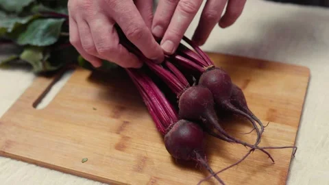 Closeup of spring fresh beetroots on a cutting board.  Video stock 310203710