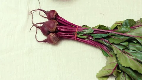 Closeup of spring fresh beetroots on a cutting board.  Video stock 310205203
