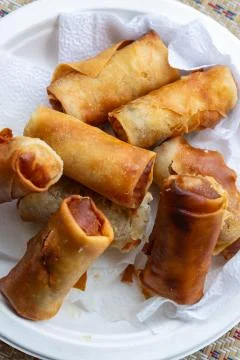 Closeup spring roll fried crispy delicious spicy stuffing shrimp vegetables Stock Photos