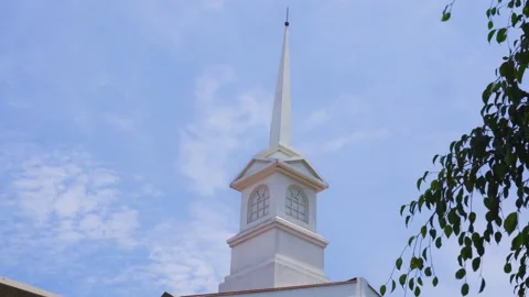Closeup of a square and pointed white chapel of a church Video stock 150303377