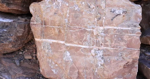 Closeup square shape multi pink color jagged rock with pattern white minerals 4k Video stock 316626479