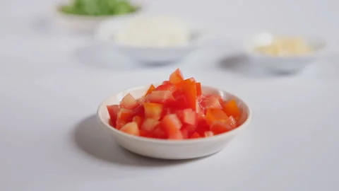 Closeup square tomatoes slice on a little plate, slider shoot Stock Footage 130850474