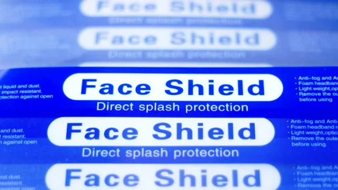 Closeup Stack of Blue FaceShield to protect from tiny droplets of virus or flu Video stock 145039948