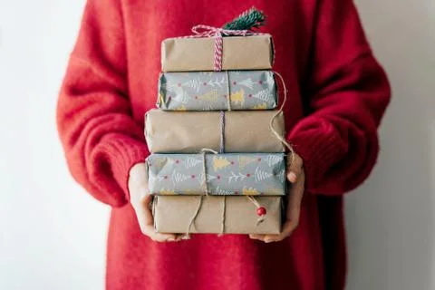 Closeup stack of boxes in female hands. Stock Photos