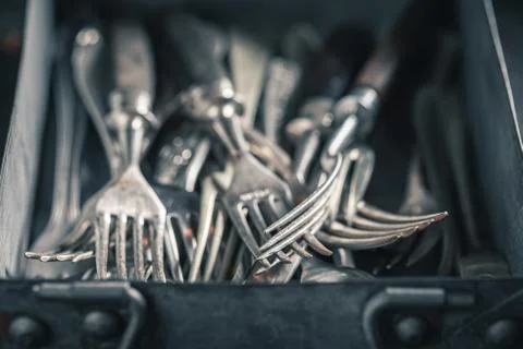 Closeup of stack of forks in a metal box Stock Photos
