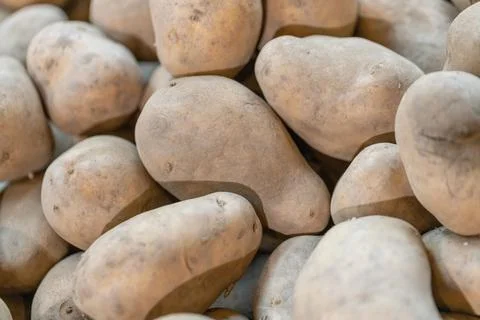 Closeup of a stack of fresh potatoes in a market 스톡 사진