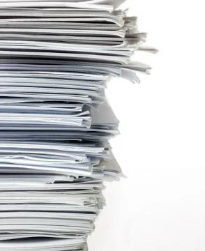 Closeup stack of papers isolated on white. Stock Photos