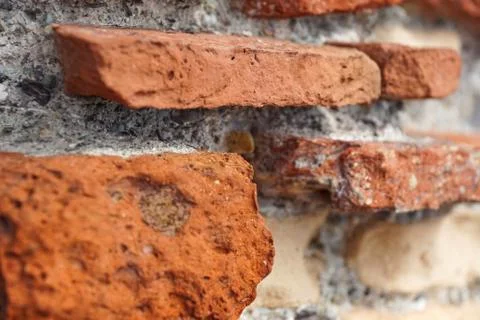 Closeup of Stack of Raw Bricks on the external wall Stock Photos