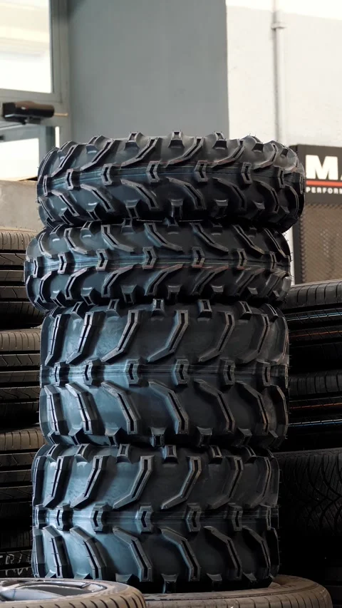 Closeup Stack of Off Road Mud Terrain Tires at Tire Service Shop Stock Footage 332828326
