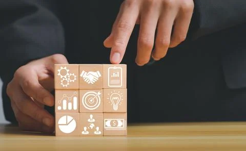 Closeup of stack woods' block step on the table with an icon about business stra Stock Photos