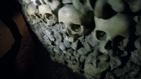 Closeup of stacks of skulls in Catacombs Stock Footage 98034932