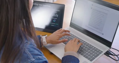 Closeup starting with hands typing while Asian female is using laptop and tablet Stock Footage 348445551
