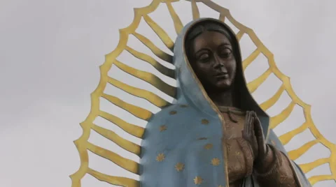 Closeup of a Statue of the Virgin Guadalupe Stock Footage 64826673