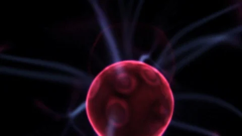 Closeup of a steady plasma ball red center with electric blue rays moving around Stock Footage 113300898