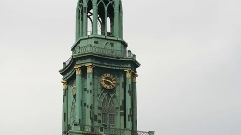 Closeup of Steeple Marienkirche with clock at cloudy day Stock Footage 79532406