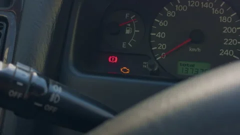 Closeup steering wheel warning lights glowing, brake lamp and engine icon create Stock Footage 333260539