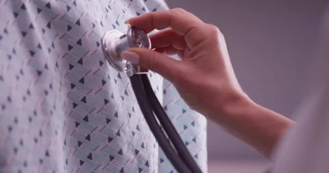 Closeup of stethoscope on patient's chest Vídeo Stock 59684673