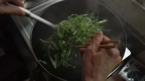 Closeup: stirring green beans with soy sauce in Chinese cooking style. Stock Footage 155445054