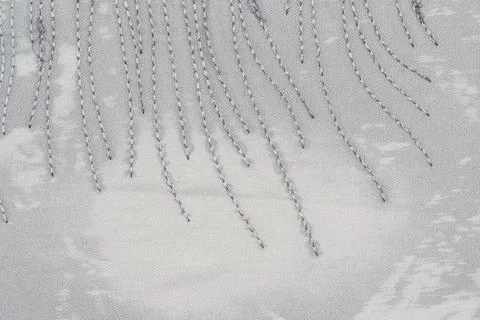 Closeup of stitched fabric with diagonal thread pattern on textured gray ba.. Stock Photos