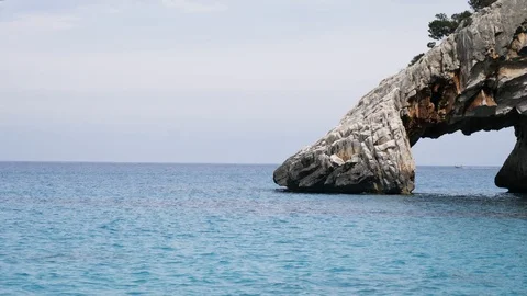 Closeup of stone arch at the beautiful Cala Goloritze Stock Footage 112119022