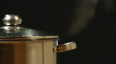 CLOSEUP: A stream breaks out of a steel pan Stock Footage 59851380