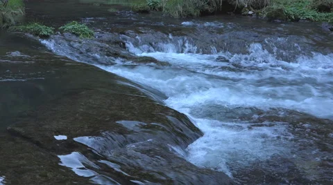 Closeup stream passing over rocks Stock Footage 40873783