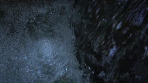 Closeup stream waterfall with foam and bubbles in slow motion. Stock Footage 118320269