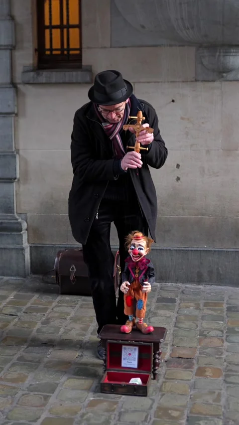Closeup of street performer with puppet in Brussels February 3 2025 Stock Footage 328033760