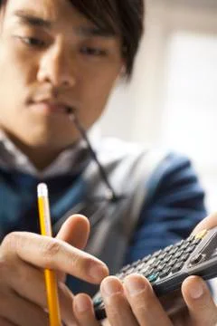 Closeup of student with calculator Foto stock