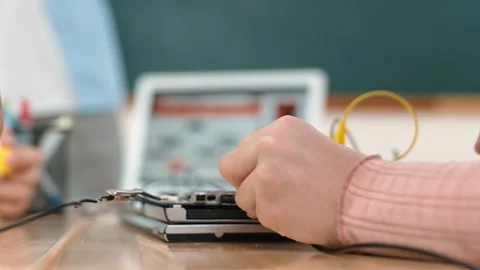 Closeup of student hands fixing main board while teacher teach prompt. Pedagogy. Stock Footage 266752975