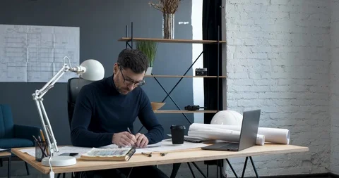 Closeup of Stylish Bearded Man in Glasses working on Laptop in modern Office Stock Footage 126159751