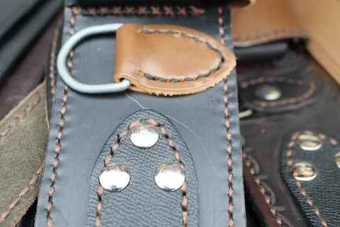A CloseUp of a Stylishly Designed Leather Strap Featuring Elegant Metal Accents Stock Photos