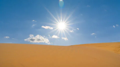 Closeup summer sandy desert dune on a blue sky background Stock Footage 141209771