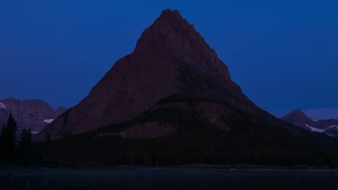 Closeup Sunrise Time Lapse at Swiftcurrent Lake Stock Footage 121985159