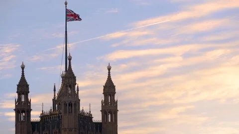 Closeup sunset view of the top of the Westminster Palace parliament building Stock Footage 262434363