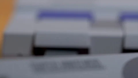 Closeup Of Super Nintendo Console And Player Controller. Stock Footage 129972908