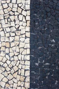 Closeup surface of blocky pattern old stone pavement Stock Photos