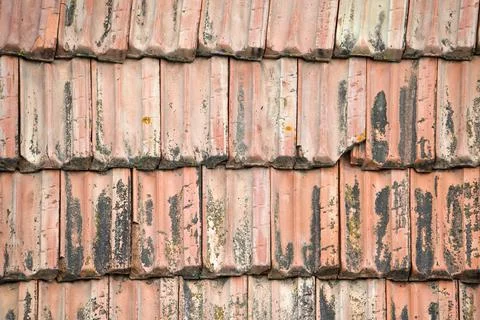 Closeup surface of old weathered ceramic tiles covering building roof Fotos de archivo